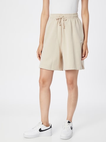 Nike Sportswear Wide leg Trousers in Beige: front