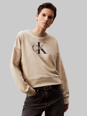 Calvin Klein JeansSweater majica - bež boja: prednji dio