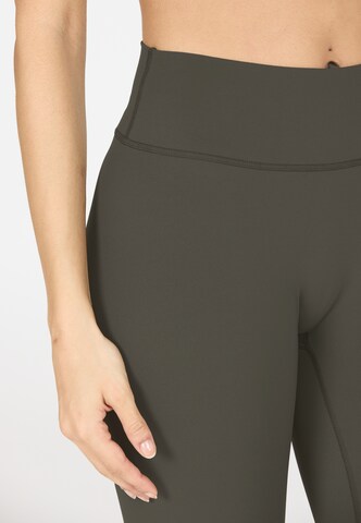 Athlecia Skinny Sportbroek 'Luxe' in Bruin