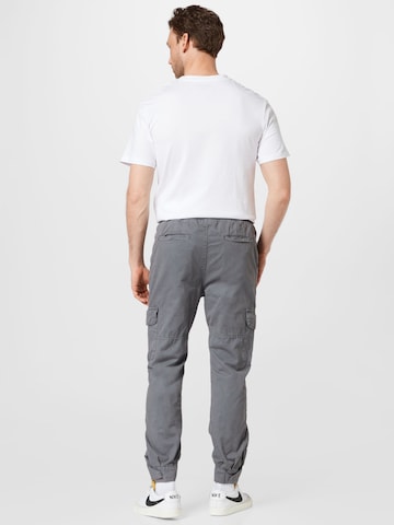 Tapered Pantaloni cargo di Urban Classics in grigio