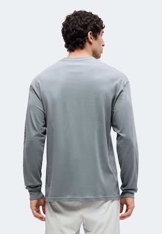 NIKE - Camisa funcionais em cinzento: atrás