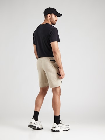 regular Pantaloni sportivi 'Unstoppable' di UNDER ARMOUR in verde