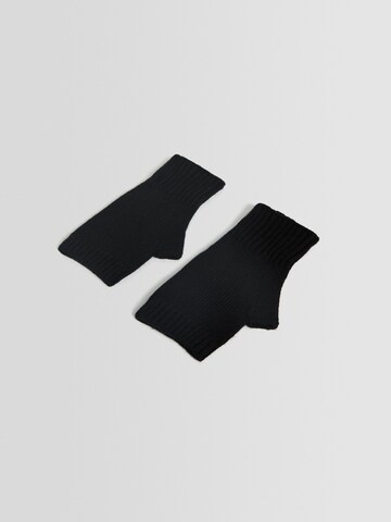 Bershka Short finger gloves in Black: front