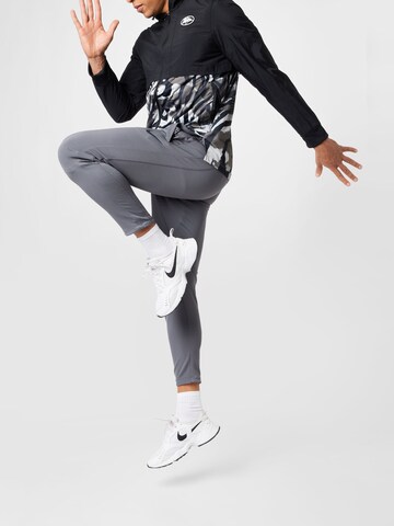 NIKE Regular Workout Pants in Grey
