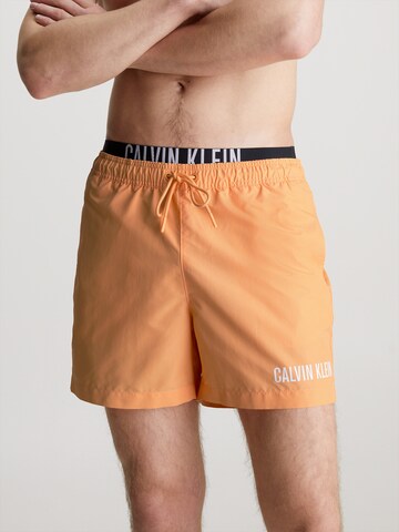Calvin Klein Swimwear Board Shorts 'Intense Power' in Orange: front