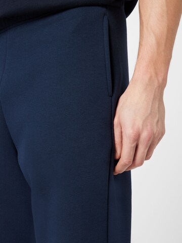 ABOUT YOU Tapered Trousers 'Jake' in Blue