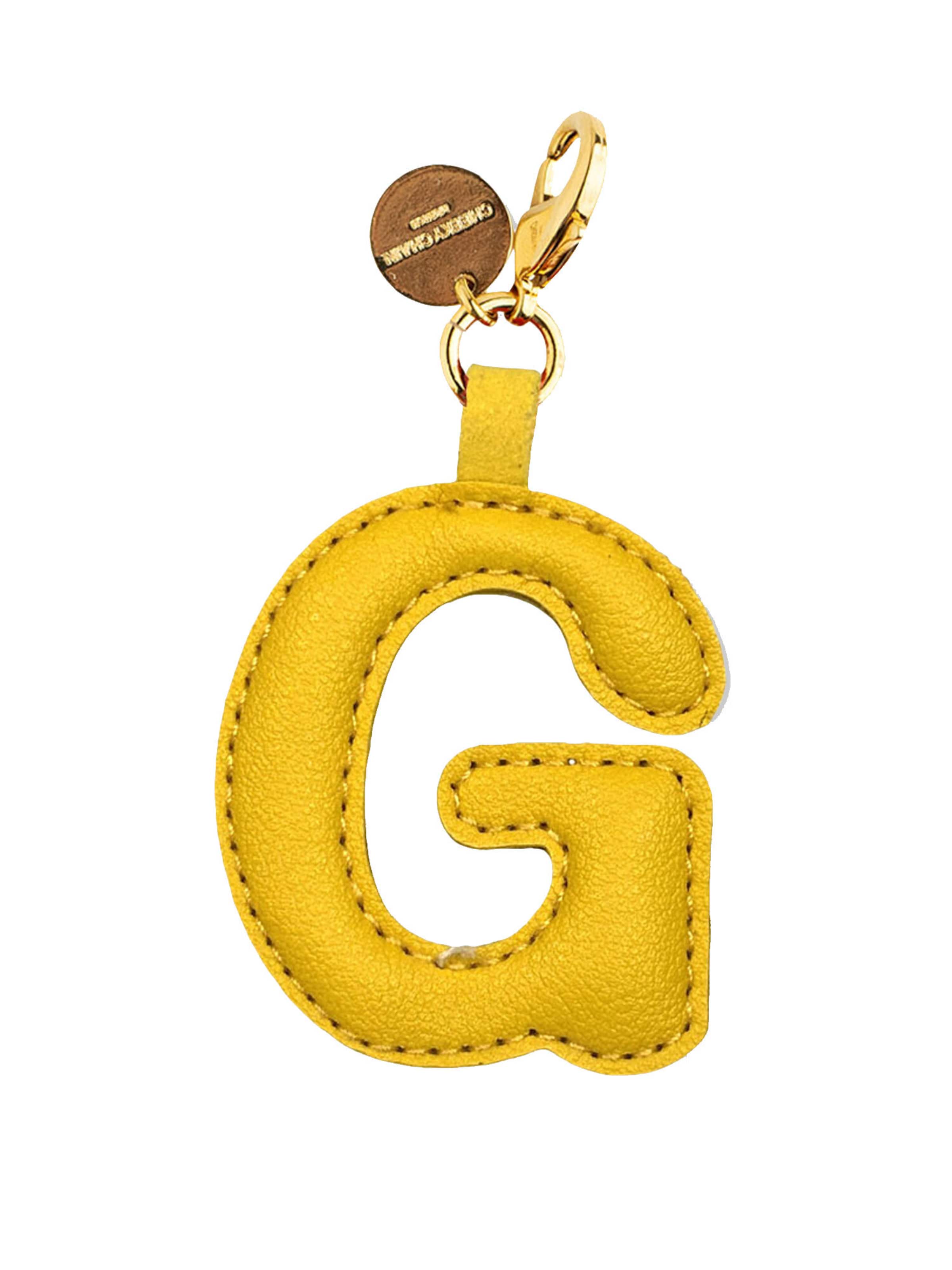 Cheeky Chain Munich Accessoires voor tassen 'Letter' in Geel: voorkant
