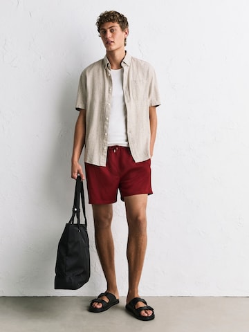 Next - Bermudas en rojo: frente