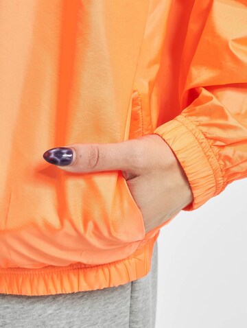 Nike Sportswear Přechodná bunda – oranžová