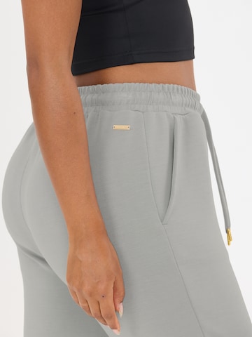 Athlecia Tapered Sportnadrágok 'Jacey V2' - szürke