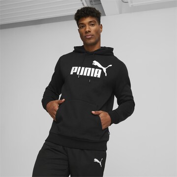 PUMA Spordidressipluusid 'Essentials', värv must: eest vaates