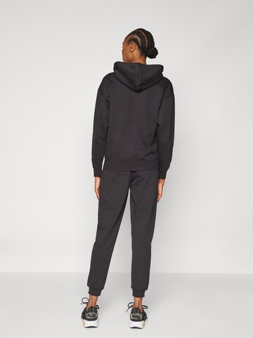 PUMA Tapered Sportbroek 'TAD Essential' in Zwart