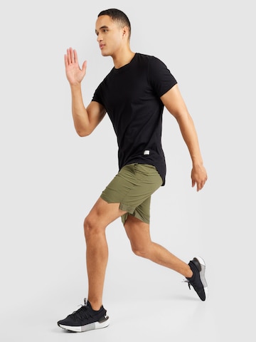 UNDER ARMOUR Regular Workout Pants 'Vanish' in Green
