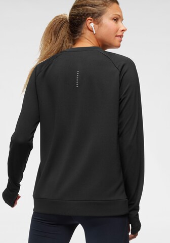 NIKE Sportief sweatshirt 'PACER' in Zwart