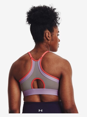 Low support Reggiseno sportivo 'Infinity' di UNDER ARMOUR in lilla