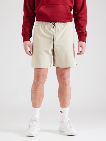regular Pantaloni sportivi 'UNLIMITED' di NIKE in verde: frontale