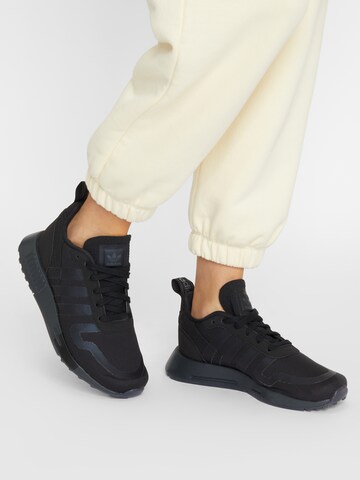 ADIDAS ORIGINALS Sneakers in Black: front