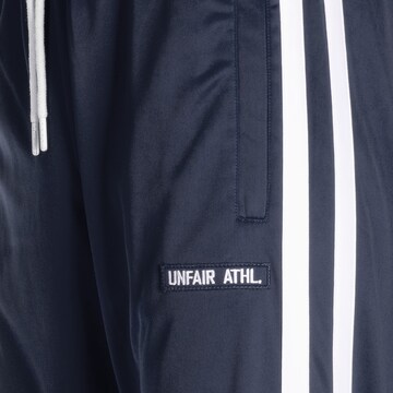 Loosefit Pantalon de sport 'DMWU Evolution' Unfair Athletics en bleu