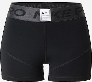 NIKE - Skinny Calças de desporto em preto: frente