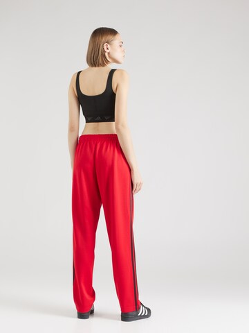 regular Pantaloni di ADIDAS ORIGINALS in rosso