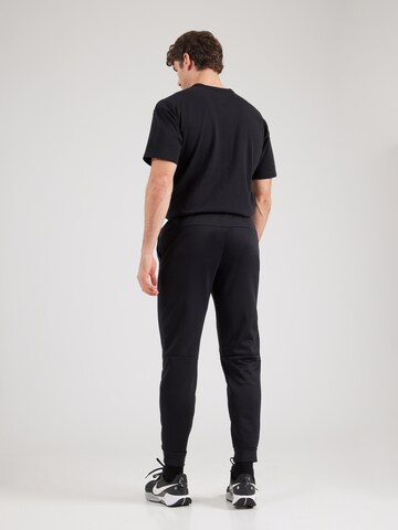 NIKE Конический (Tapered) Спортивные штаны 'Therma Sphere' в Черный