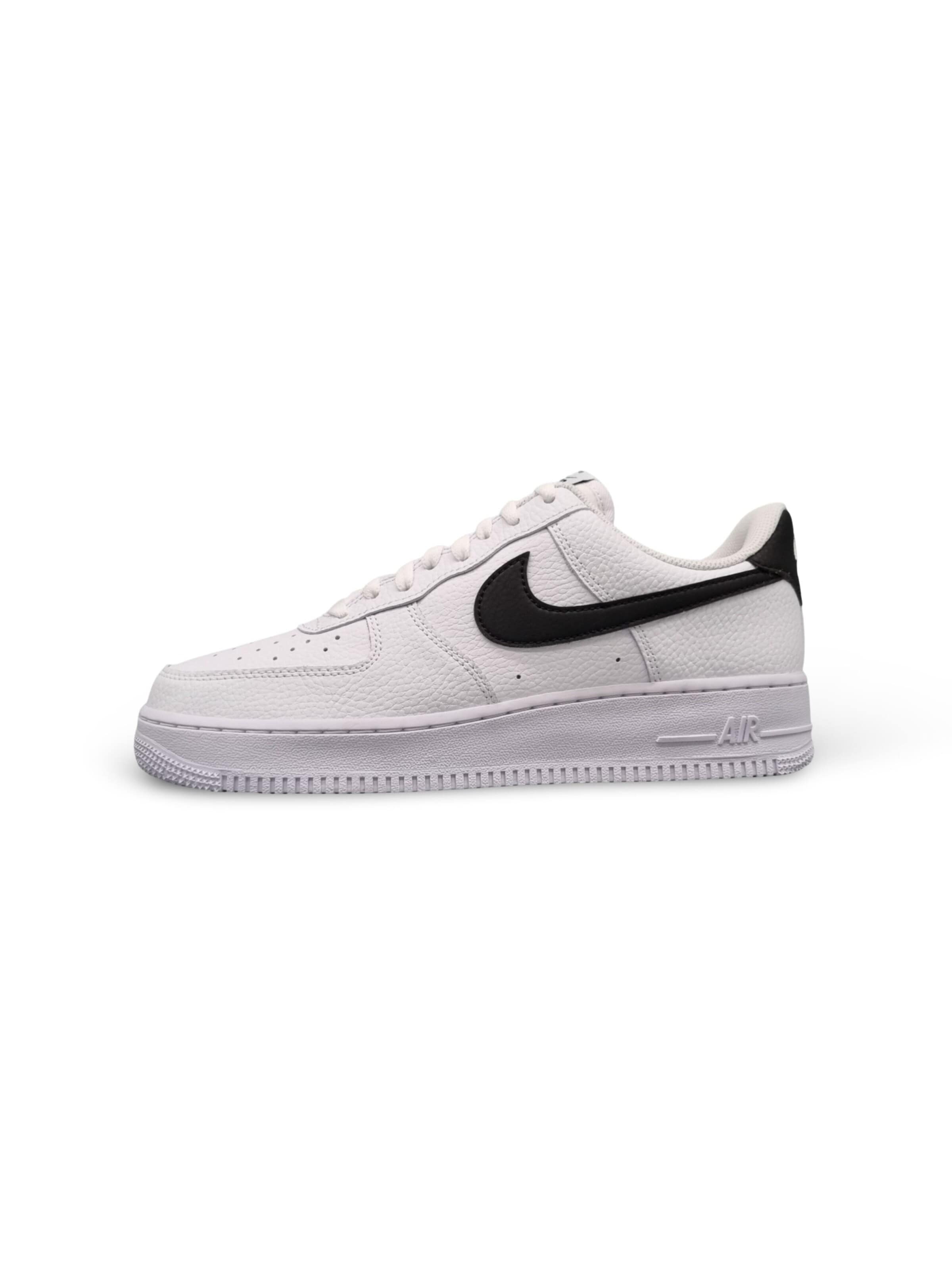 NIKE Sneakers 'Nike Air Force 1 Low '07 White Black Pebbled Leather' in White: front