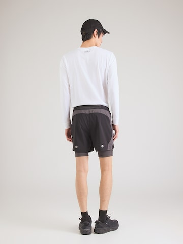 ASICS Regular Urheiluhousut 'Road' värissä musta