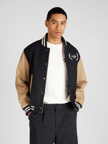 TOMMY HILFIGER Between-Season Jacket 'VARSITY' in Black: front