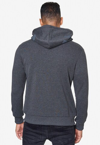 Rusty Neal Zip-Up Hoodie in Grey