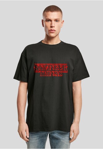T-Shirt 'Stranger Things' Merchcode en noir : devant