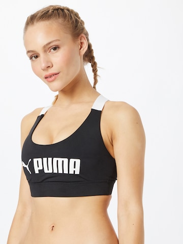 PUMA Bralette Sports Bra in Black: front