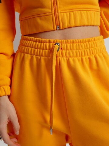 A LOT LESS Tapered Trousers 'Ida' in Orange