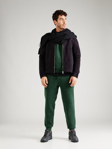 ABOUT YOU x Jaime Lorente Tapered Trousers 'Taylan' in Green