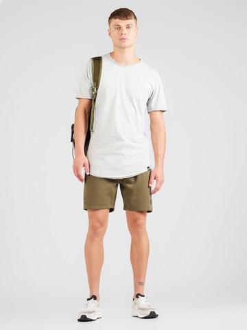 Hummel Regular Sports trousers in Green