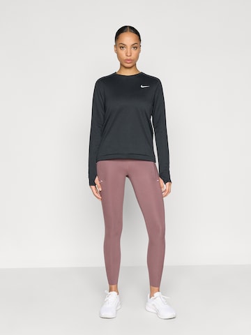 NIKE Skinny Športové nohavice 'SWIFT' - Fialová