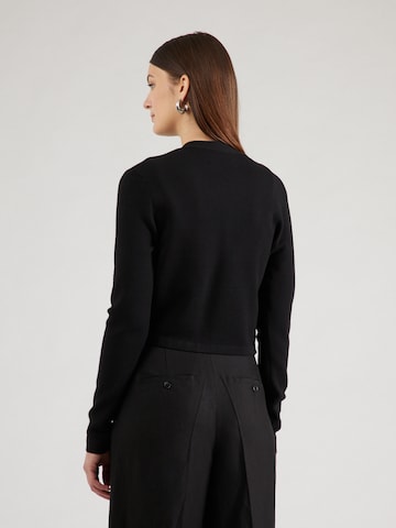 melns Karl Lagerfeld Adīta jaka: no aizmugures