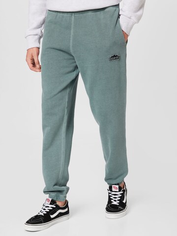 Superdry Tapered Trousers in Green: front