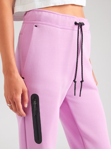 Tapered Pantaloni 'TCH FLC' di Nike Sportswear in rosa