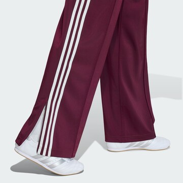 ADIDAS ORIGINALS - Pierna ancha Pantalón 'Firebird Adicolor' en rojo