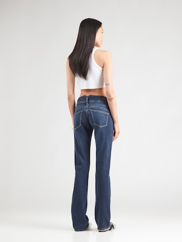 évasé Jean Herrlicher en bleu : derrière