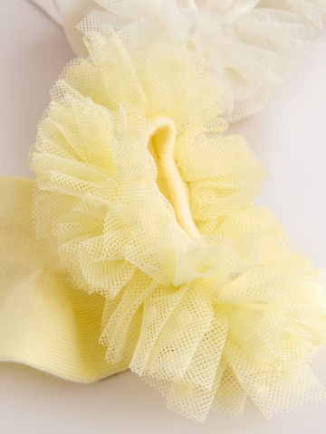 Next - Calcetines en amarillo
