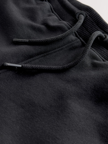 Next Дънки Tapered Leg Панталон в черно