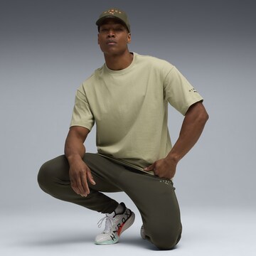 PUMA Regular Sports trousers in Green