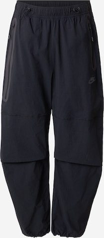 Nike Sportswear Loosefit Toiminnalliset housut 'Tech' värissä musta: etupuoli