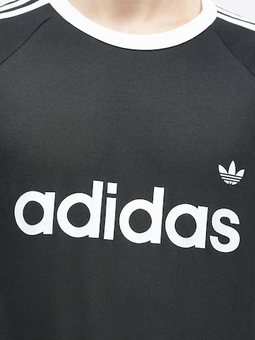 ADIDAS ORIGINALS Paita 'Ringer' värissä musta