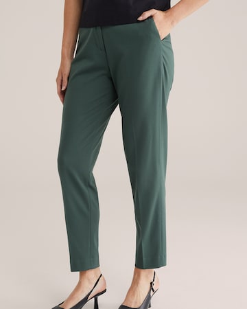 Slimfit Pantaloni con piega frontale di WE Fashion in verde: frontale