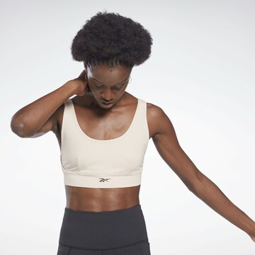 Bustier Soutien-gorge de sport Reebok en beige : devant