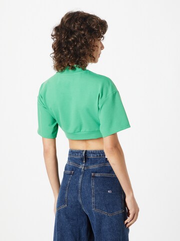 Tricou de la Tommy Jeans pe verde