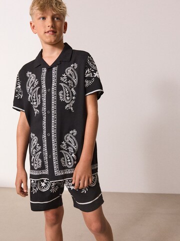 Set di Next in nero: frontale