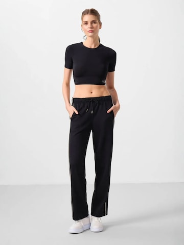 Pantalon Tommy Life en noir : devant